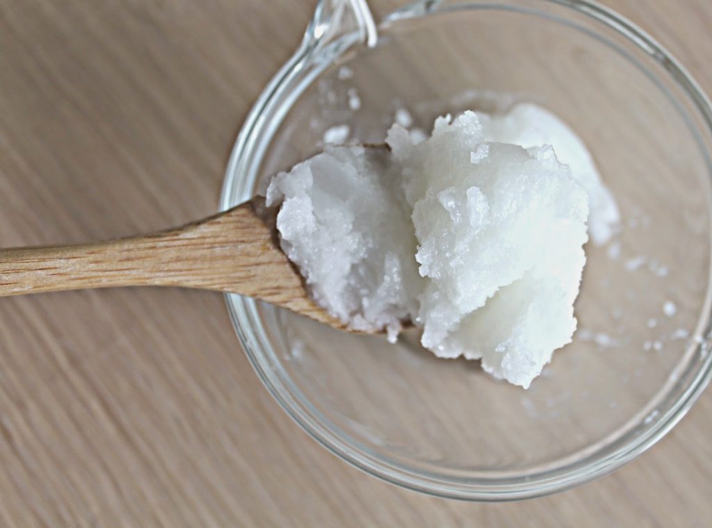 Coconut Oil on a spoon in a bowl
