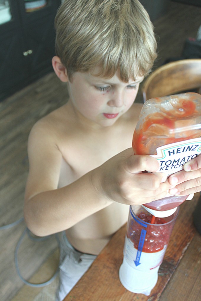Measuring out Ketchup to make Homemade BBQ Sauce
