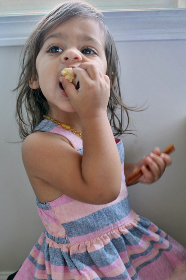 Little Girl Eating Paleo Apple Pie Crumb Bars
